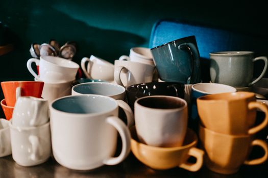 White Ceramic Mugs on Blue Table