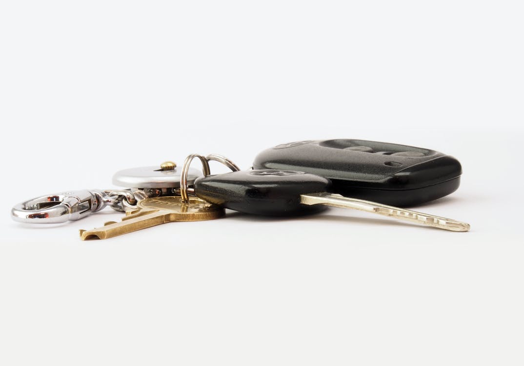 Free Car Keys on White Surface Stock Photo