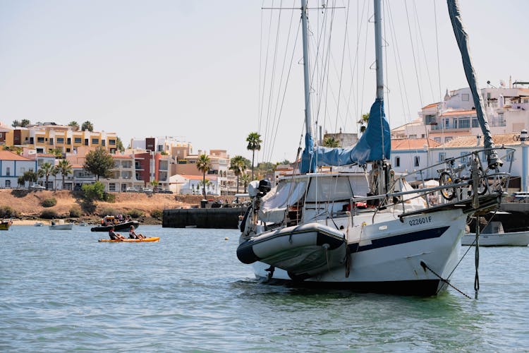 A Boat Anchored In The Sea During The Day