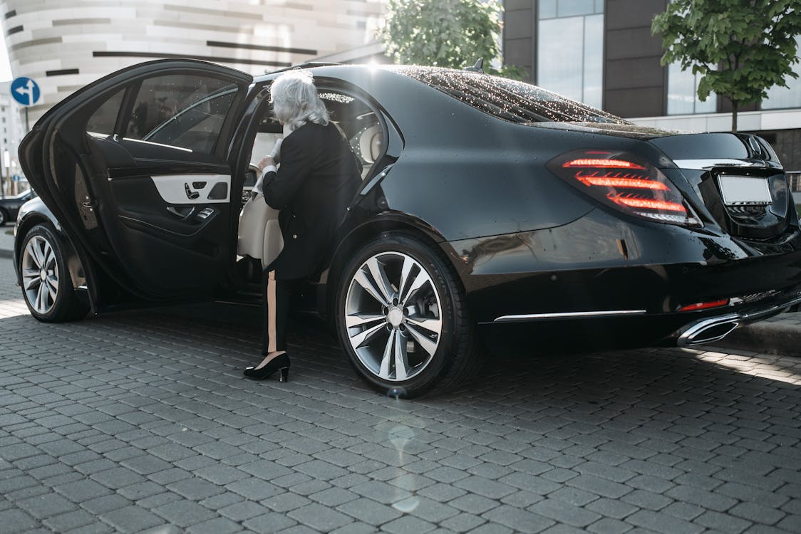 Free Woman Riding a Black Vehicle Stock Photo