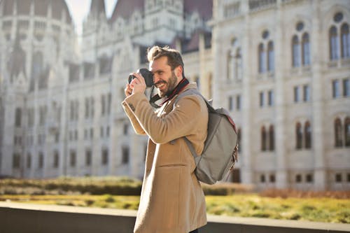 Free Man Holding and Capturing Images Around Him Stock Photo