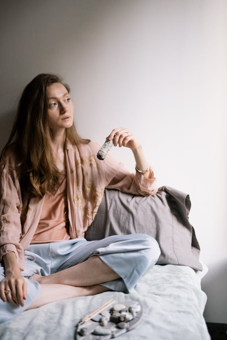 Woman Holding A Burning Sage