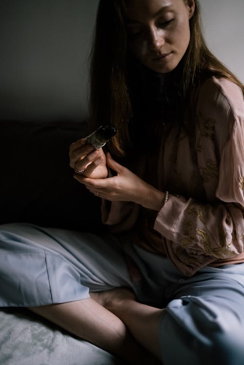 Woman Holding a Burning Sage