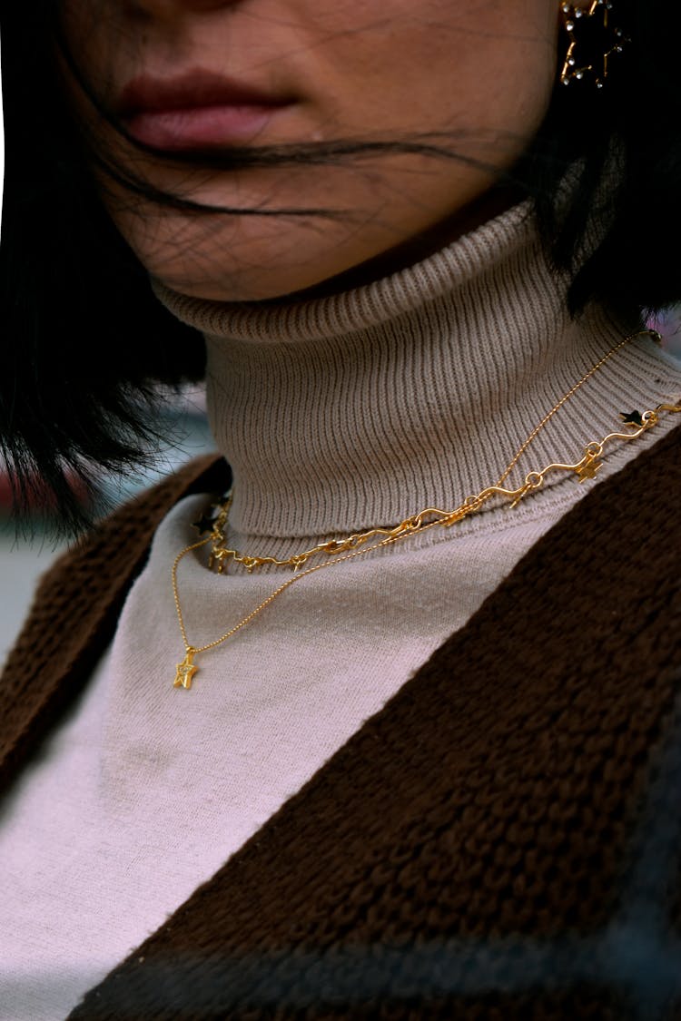 Golden Necklaces On Turtleneck Sweater