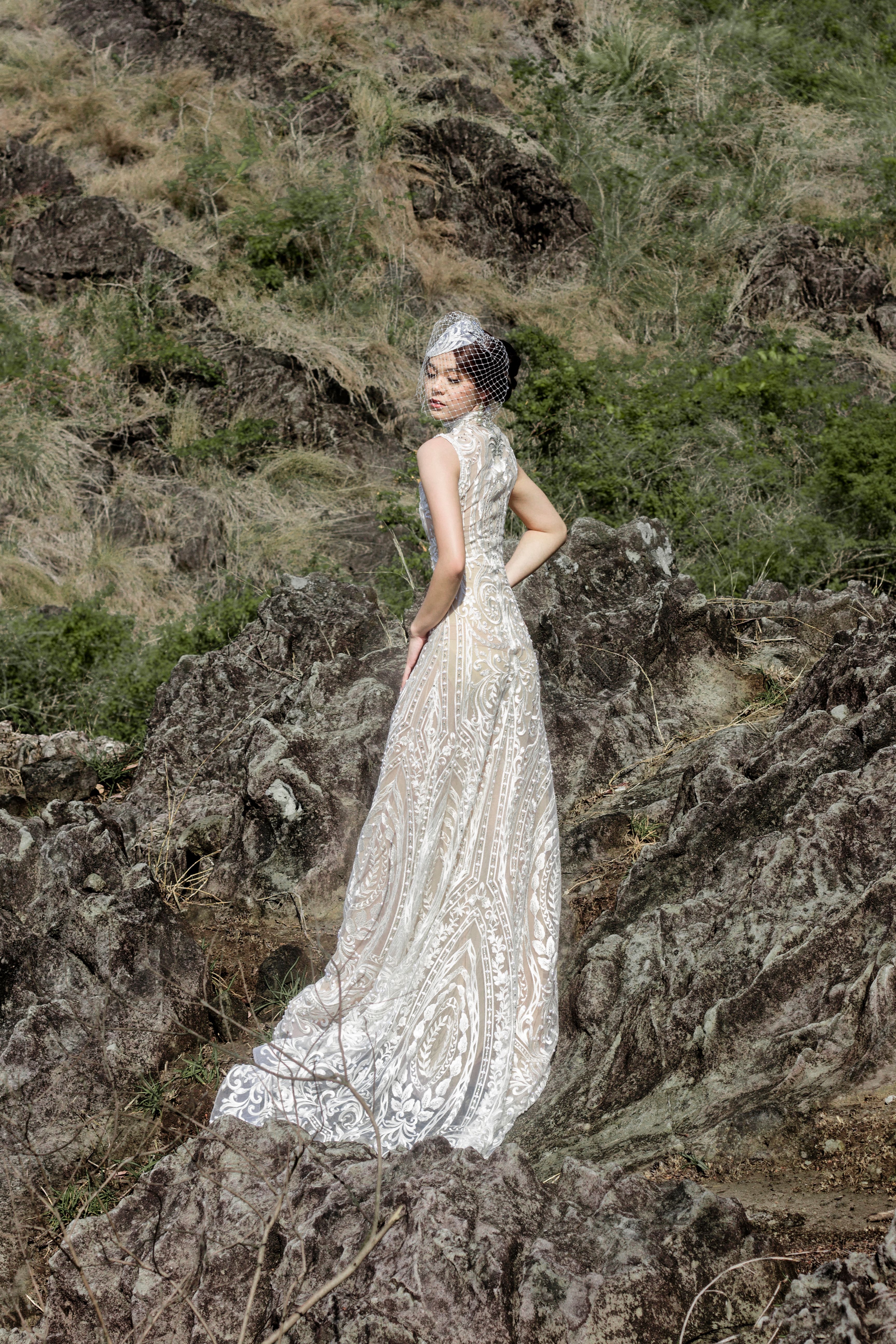 Woman in White Dress Standing on Rocky Hill · Free Stock Photo