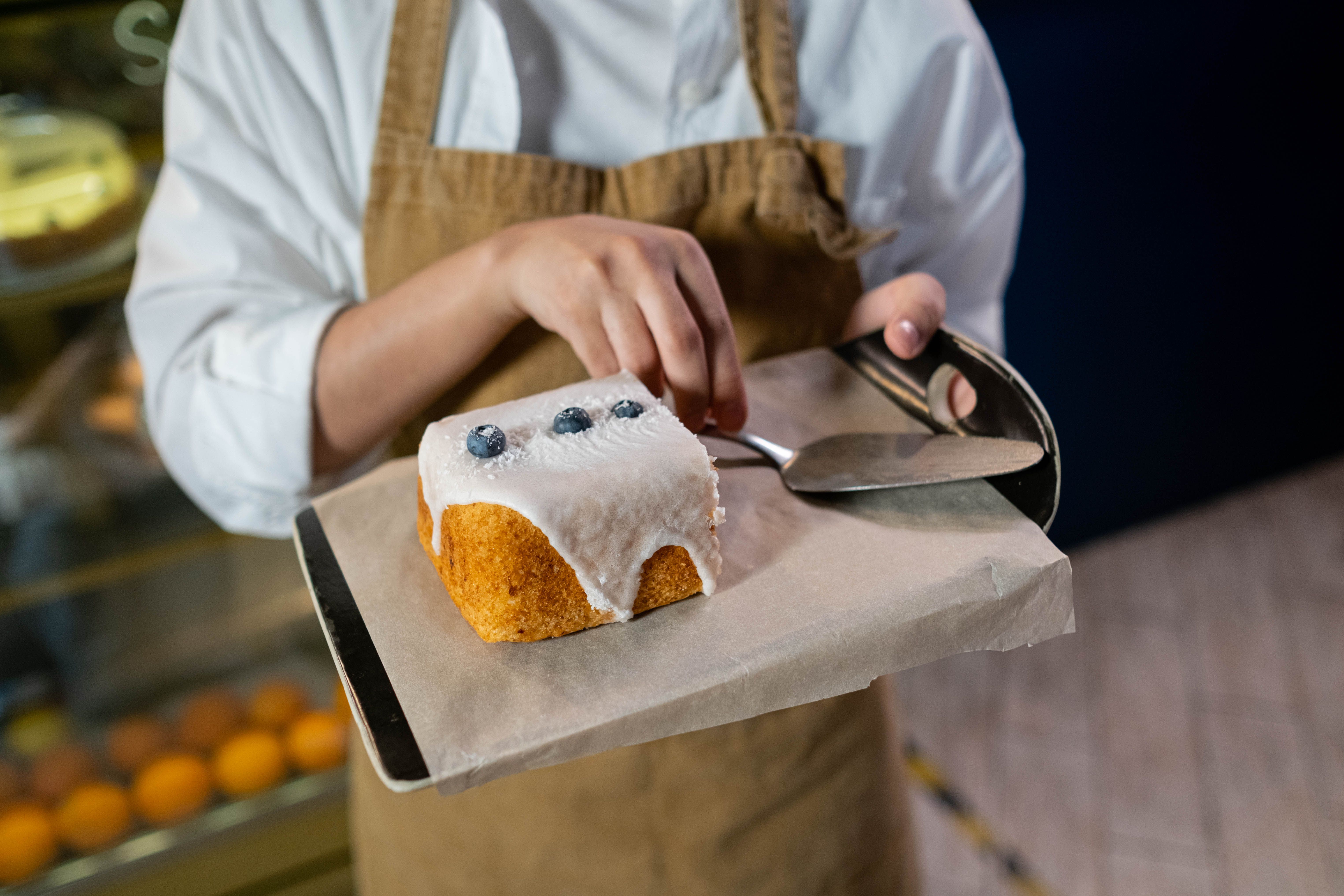 Sweet keto lemon blueberry cake slice with cream cheese frosting