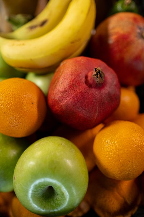 Free Colorful assortment of fresh fruits including bananas, apples, and oranges. Stock Photo