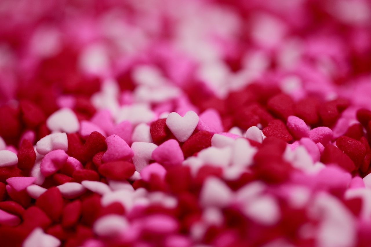 close up of pink and red heart shaped candy sprinkles perfect for vale