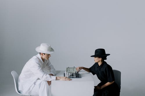 Woman Making a Move on a Chess Game