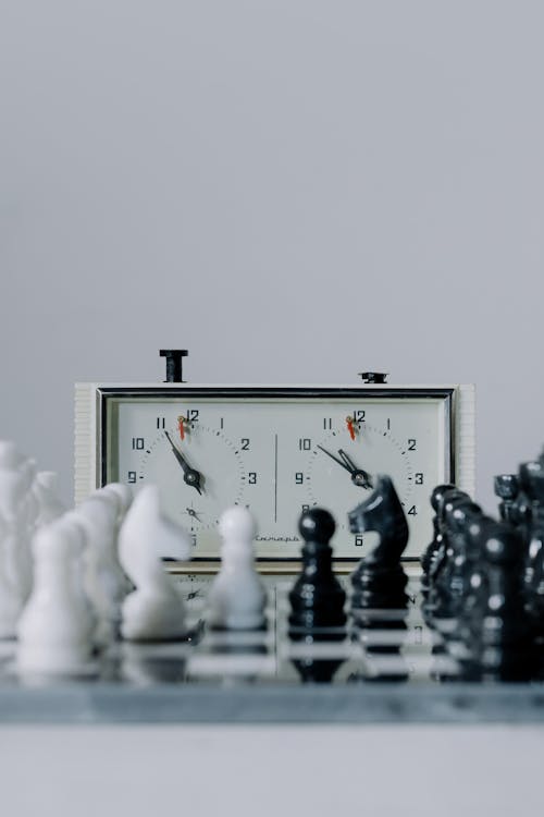 Free White and Black Chess Pieces on a Chess Board Stock Photo