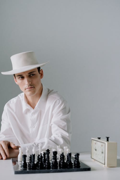 Man in White Dress Shirt Wearing White Hat