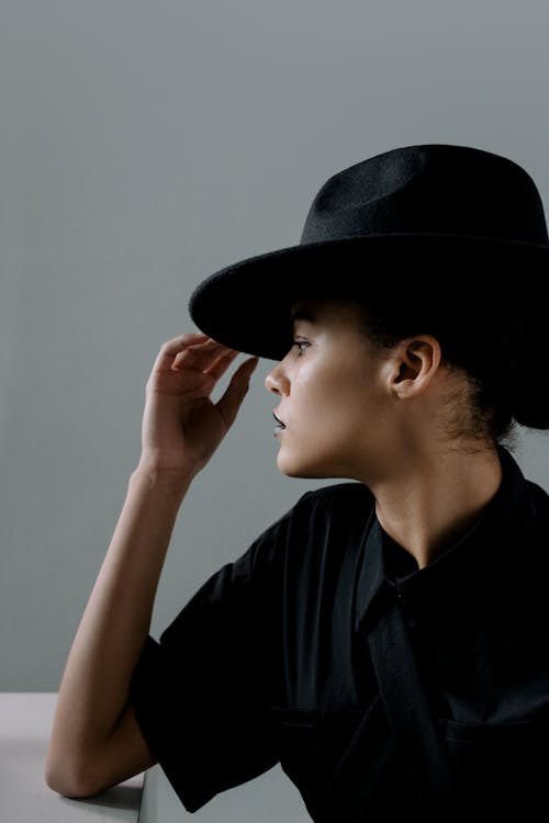 Woman Wearing a Black Hat