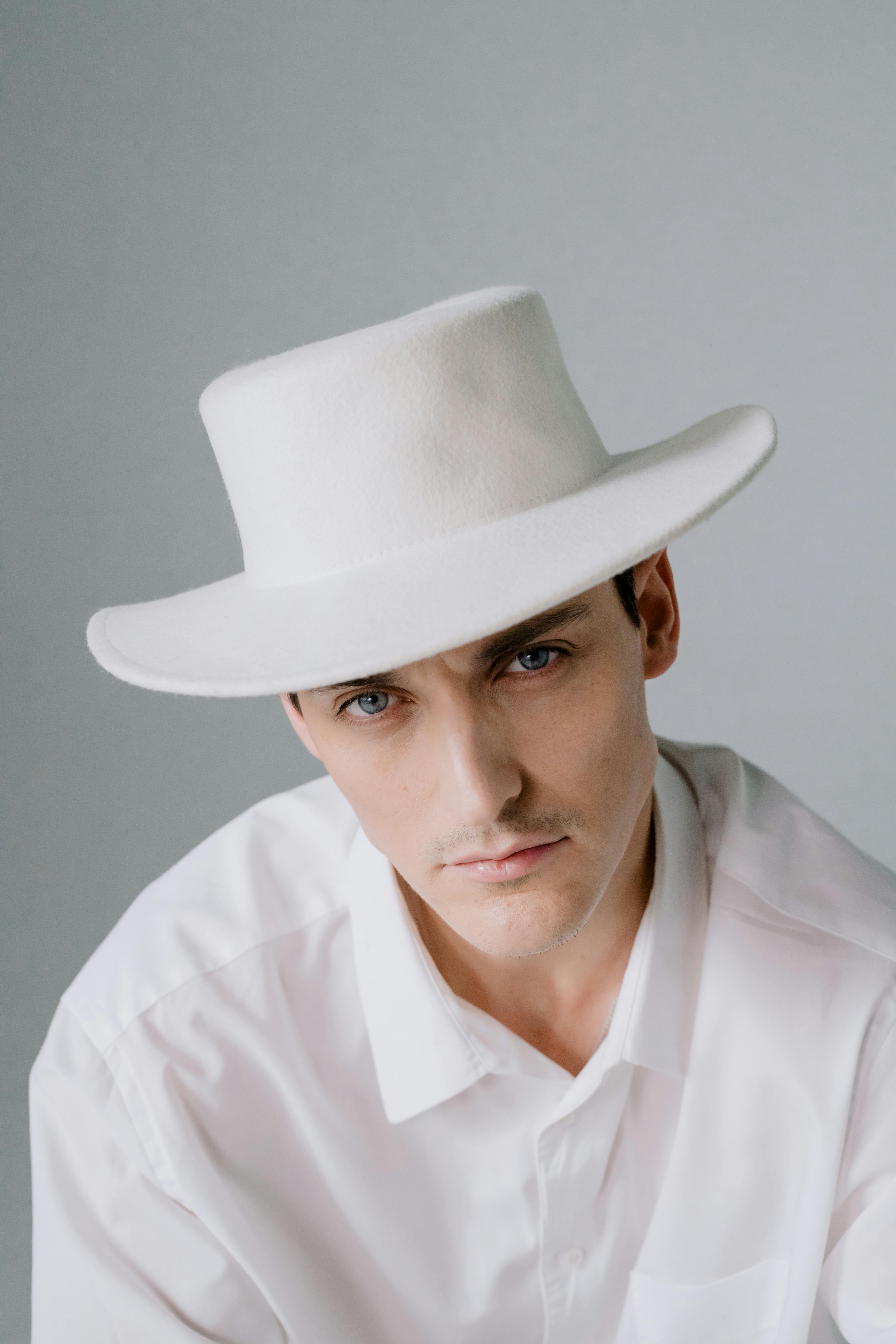 Man in white dress shirt wearing brown fedora hat photo – Free