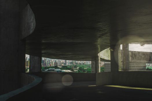 透过城市中带有绿地和建筑的混凝土结构观看城市景观