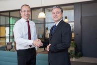 Man in Black Suit Standing Beside Man in Black Suit