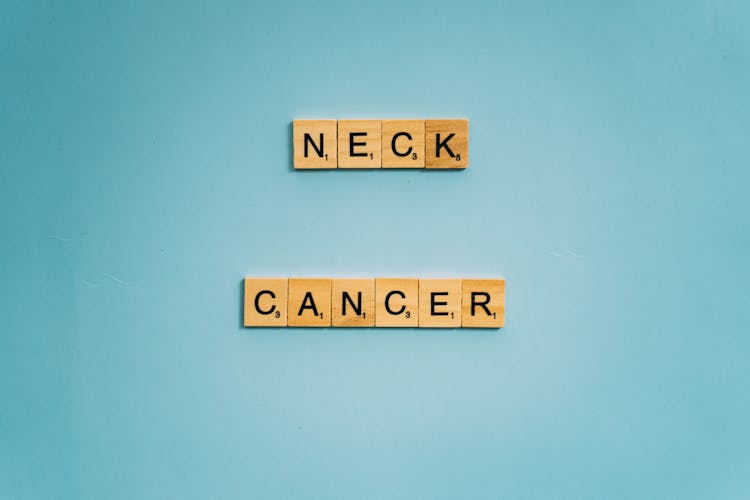 Neck And Cancer Words Spelled On Wooden Scrabble Tiles