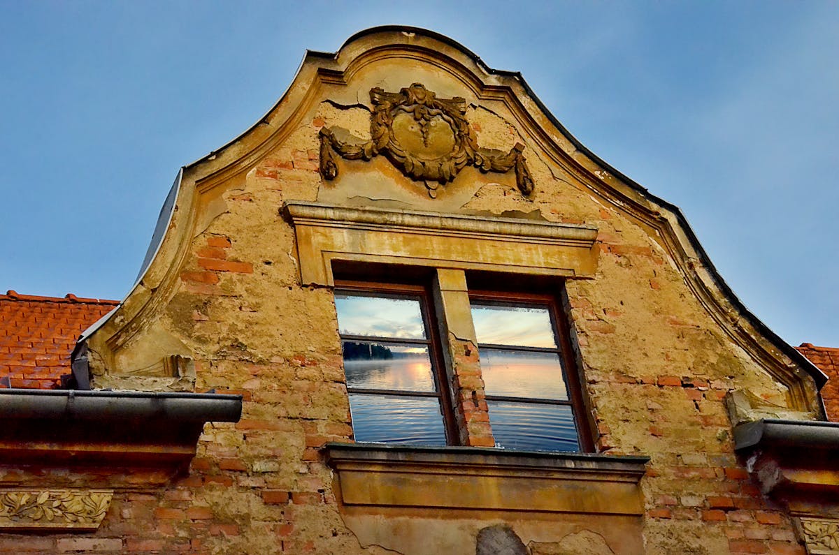 Caregiver gently holding hands with an older adult living with dementia