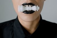 Person With White Plastic Tool on His Mouth