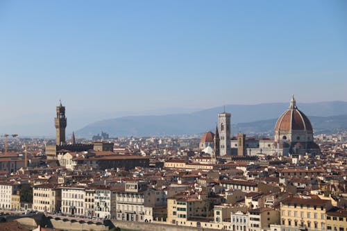 Free Cityscape with Towers and Domes and Hills in Background Stock Photo