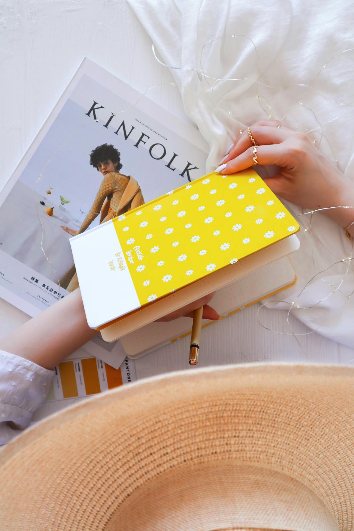 Stylish neutral bedroom with layered bedding and soft lighting reflecting quiet luxury style