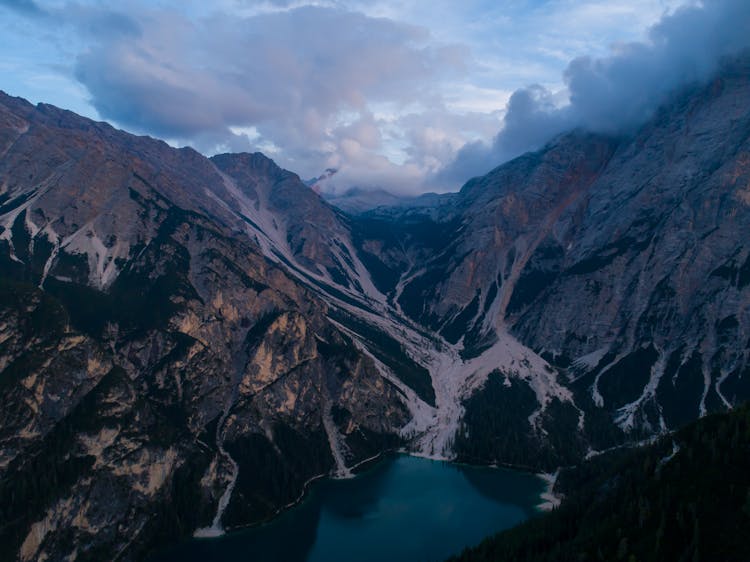 Rocky Mountains Around Lake In Valley