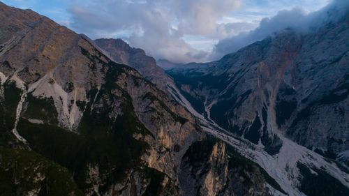 Free A breathtaking aerial view of rugged mountains with cloudy skies, showcasing nature's grandeur. Stock Photo