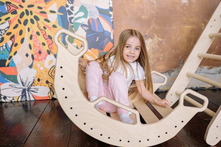 A Girl In A Wooden Rocker