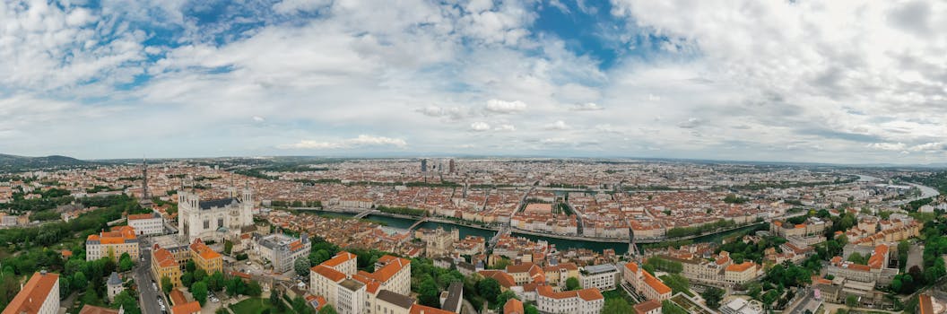 Aerial view of Lyon, France showcasing the city's architecture and the Saône River.