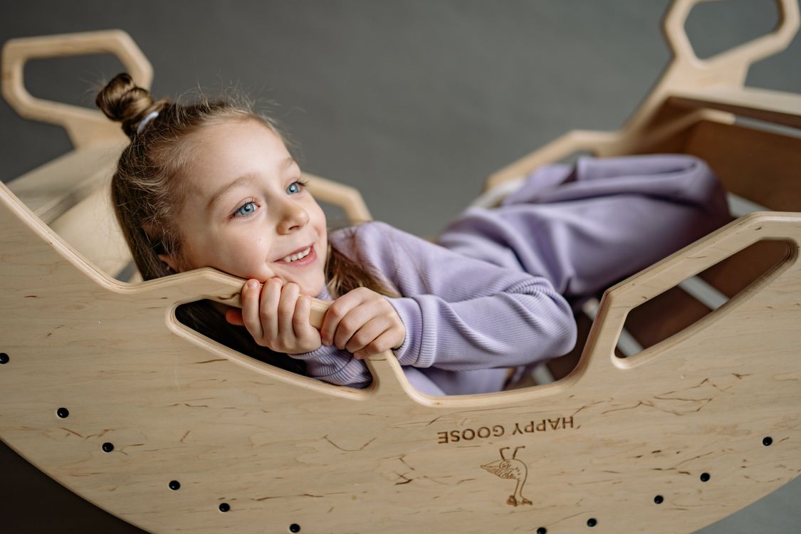 Cute Little Girl in a Wooden Rocking Boat · Free Stock Photo