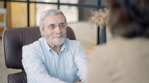 Elderly Man in Blue Dress Shirt Smiling