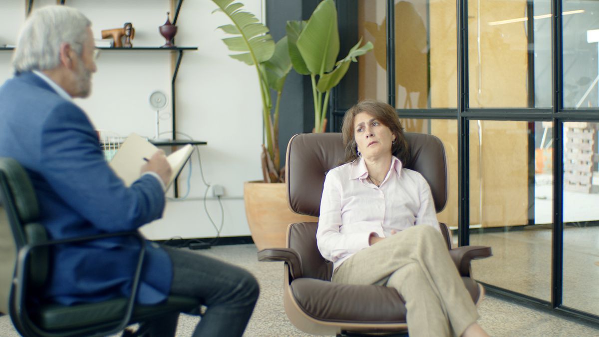 Therapist and client in a warm, supportive counseling session