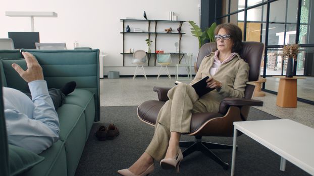 A Psychiatrist Listening to a Patient