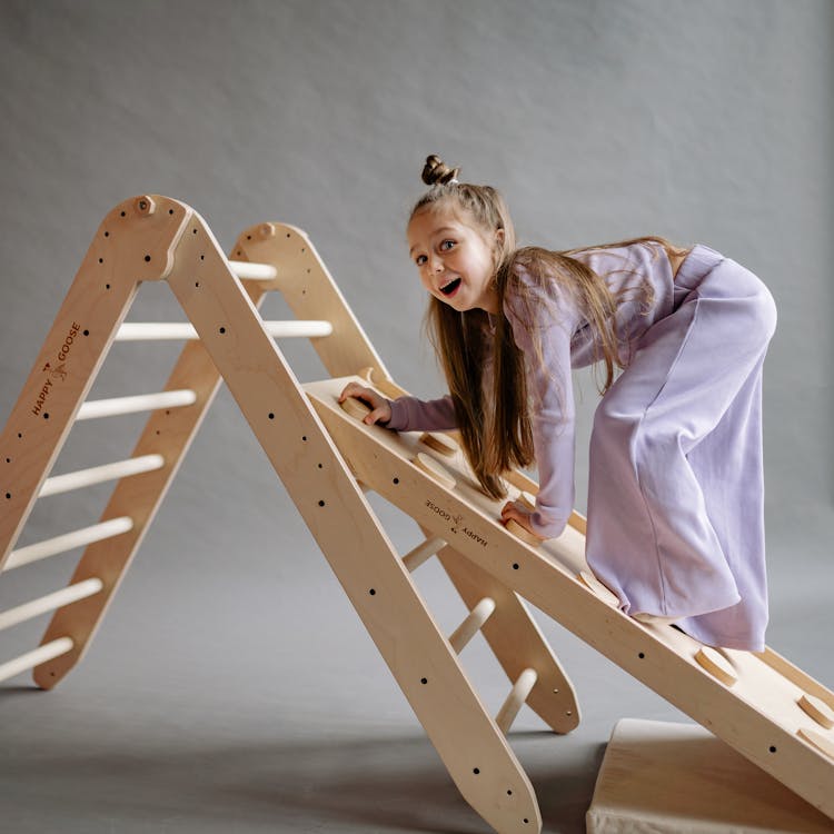 Girl Climbing Toy Ladder