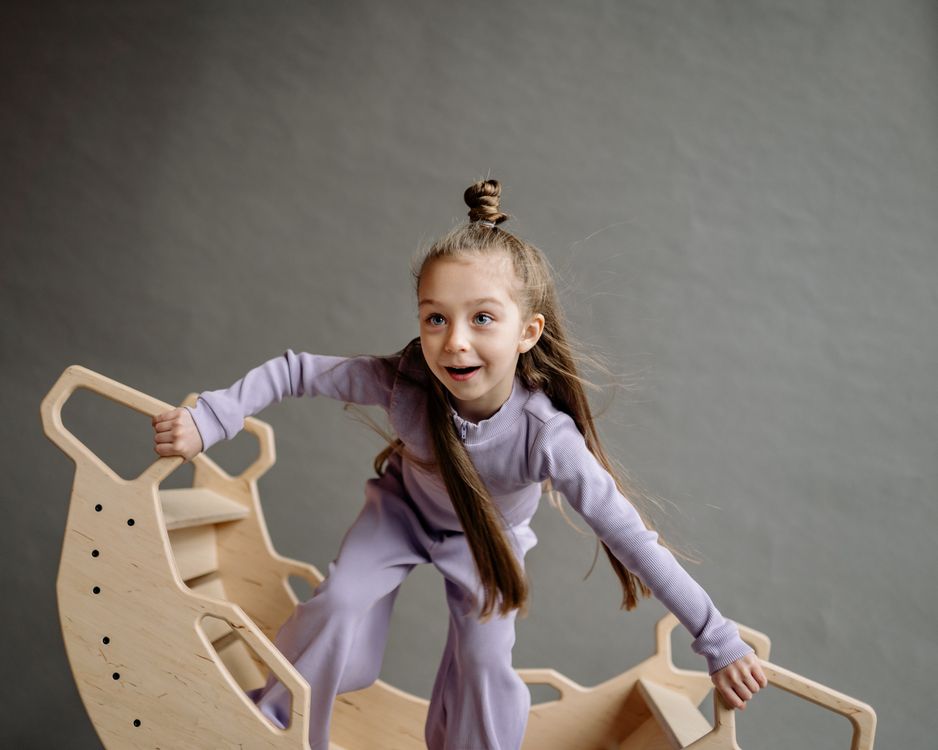 Cute Little Girl in a Wooden Rocking Boat · Free Stock Photo