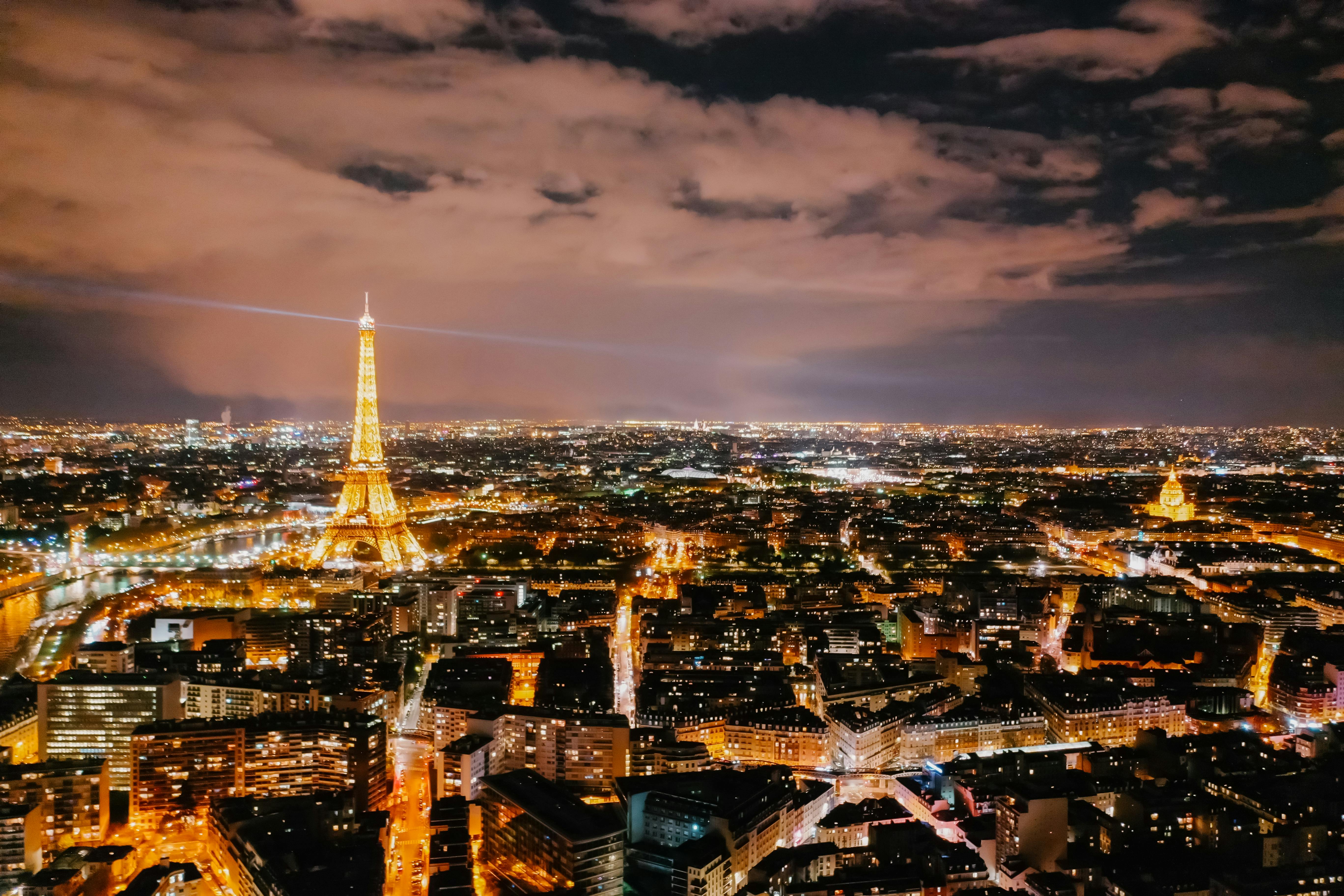 aerial shot of the city of paris during nighttime