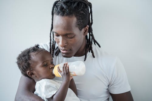 Free A Man Feeding Her Daughter Stock Photo