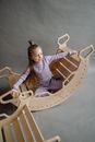 A Girl Sitting on a Double Rocker