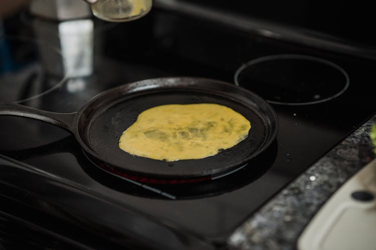 Black Frying Pan On An Induction Stove