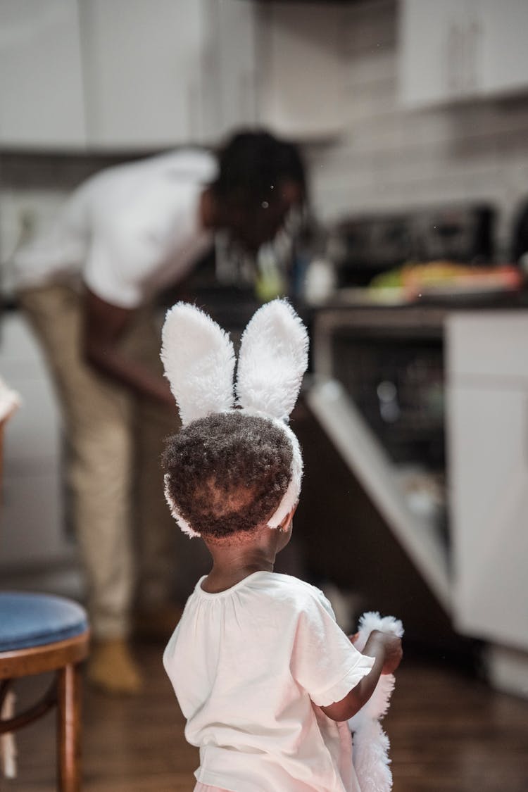 A Child Standing On Her Backside