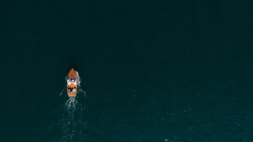 Aerial View of a Wooden Motorboat Sailing on the Sea