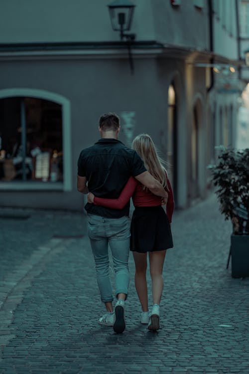 Free Couple Walking on Sidewalk Stock Photo