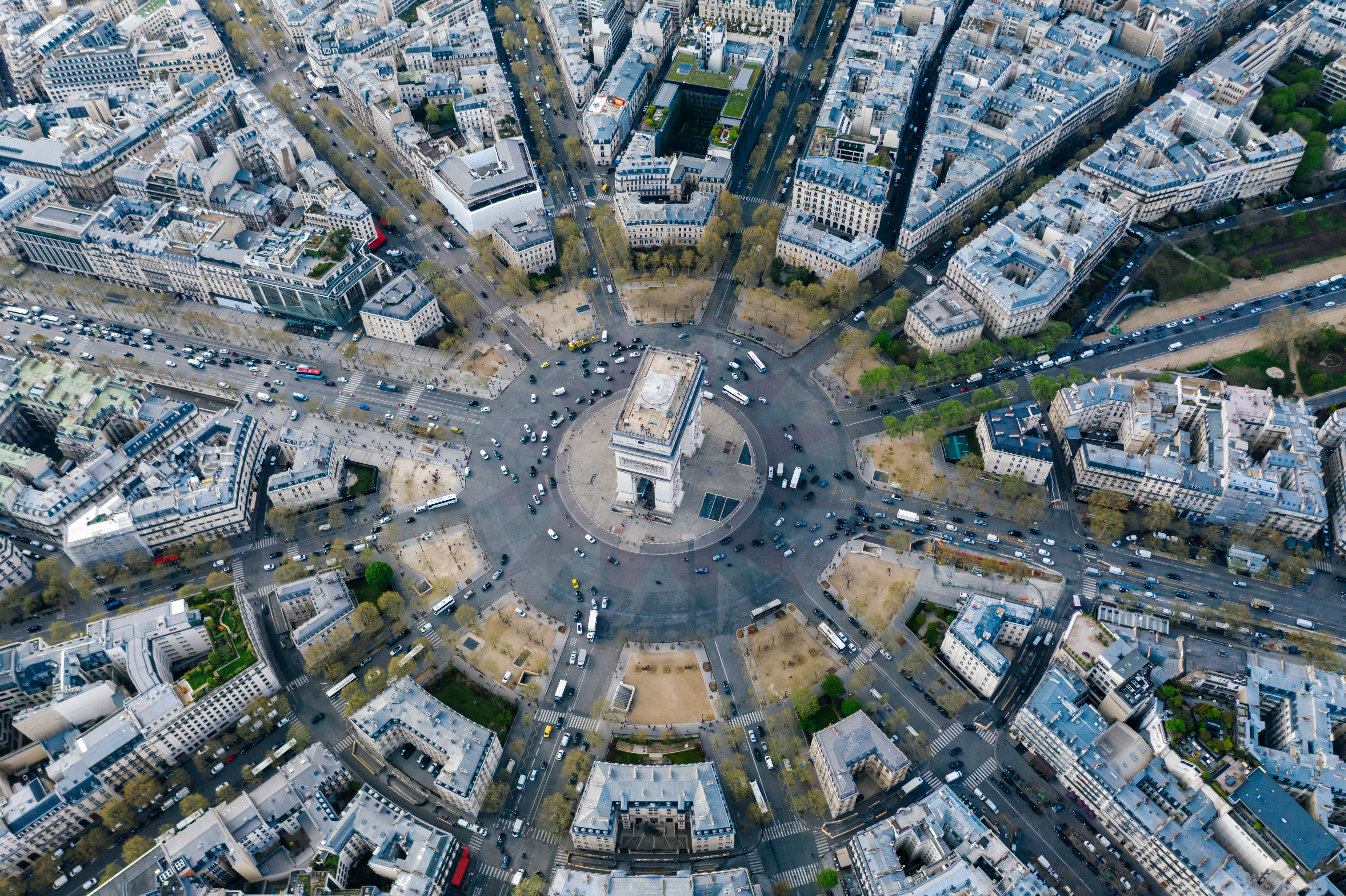 Aerial view of the Arc de Triomphe at the centre of a busy Paris roundabout