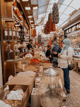 A lively scene inside a spice market with colorful displays and customers exploring the diverse offerings.