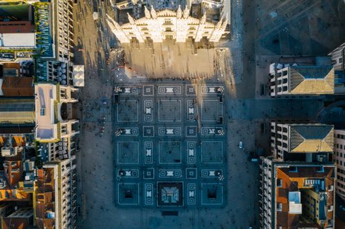 Free Stunning aerial photo of a classic European city square and towering cathedral. Stock Photo