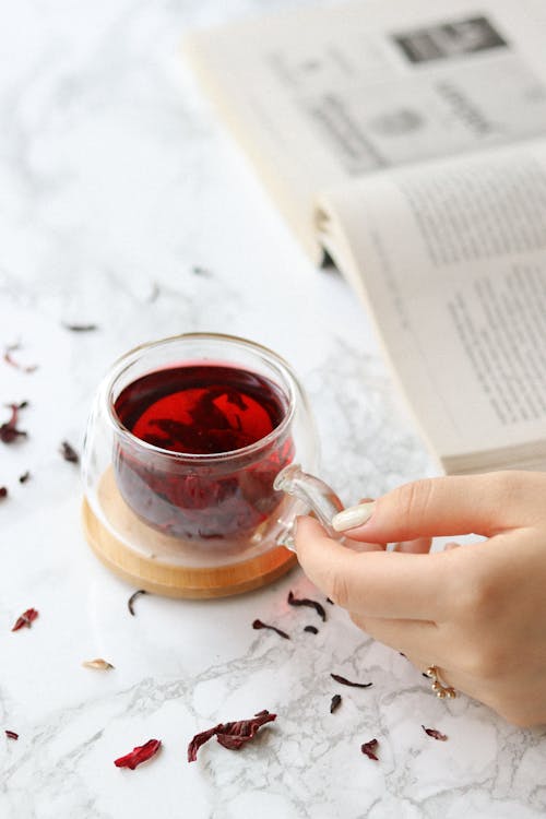 Free Cup of tea and book on table Stock Photo