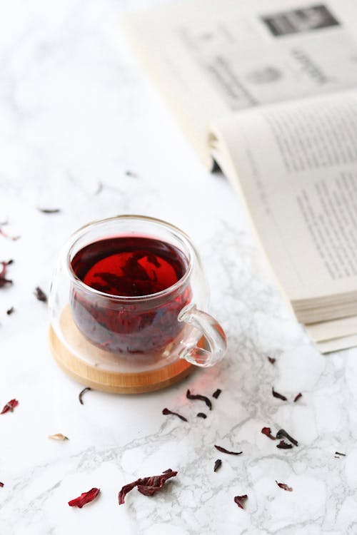 Free Opened book and cup of fresh tea Stock Photo