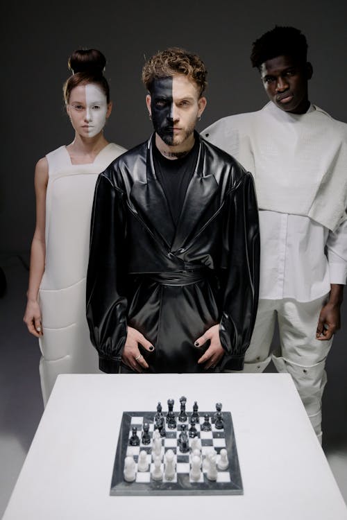 Fashion Models Posing with Chess Board Game