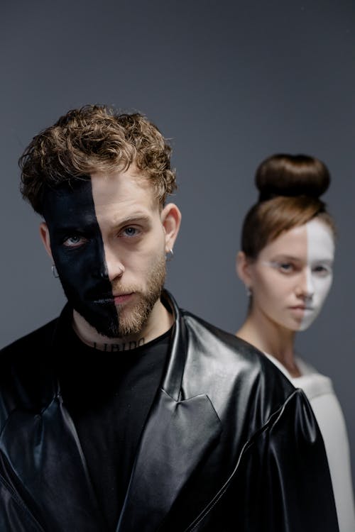 A Man and a Woman's Face Painted in Halfportrait