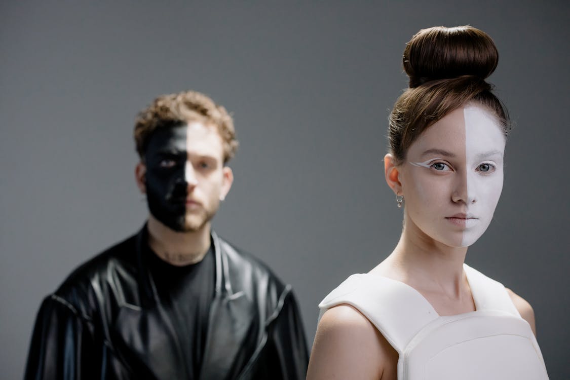 A Man and Woman in Black and White Outfits