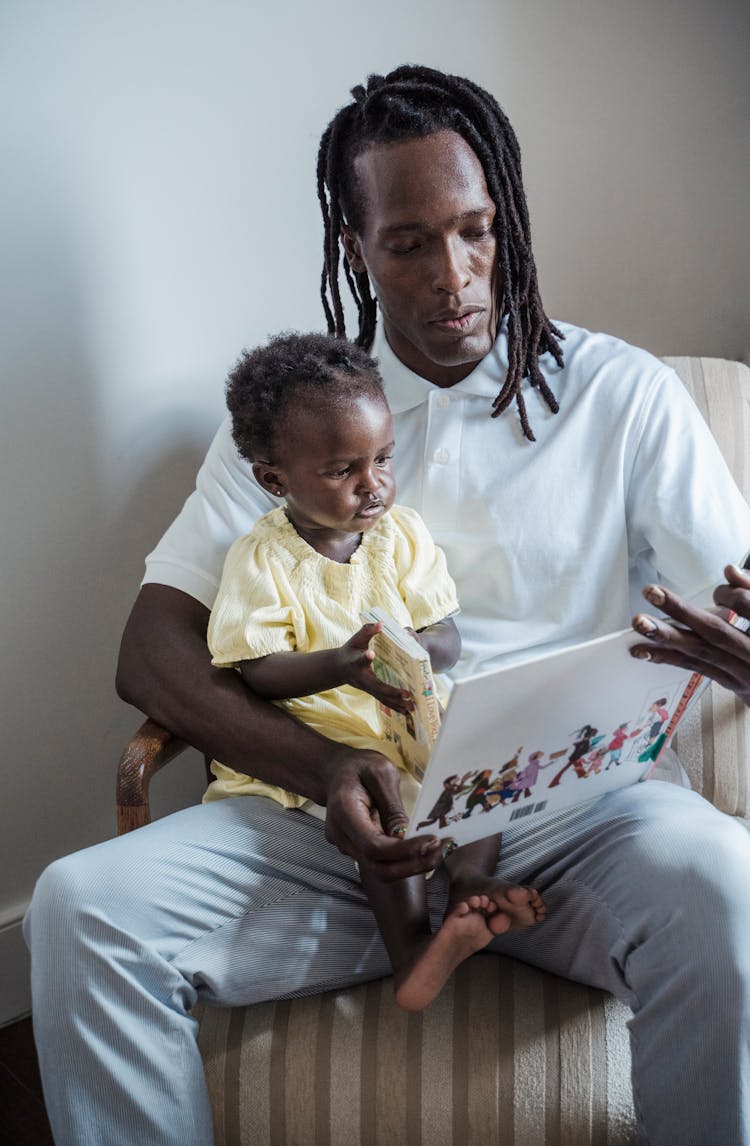 Father Reading Book To Son